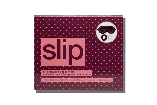 Slip Lottie Beauty Sleepover Set packaging box, featuring a dark burgundy background with a pattern of small pink hearts, a large pink square containing the 'slip' logo, and a white circular graphic showing what is included.