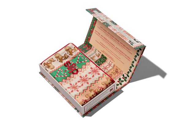 An open Christmas-themed slip silk pillowcase box, photographed on a clean white background with a soft shadow.