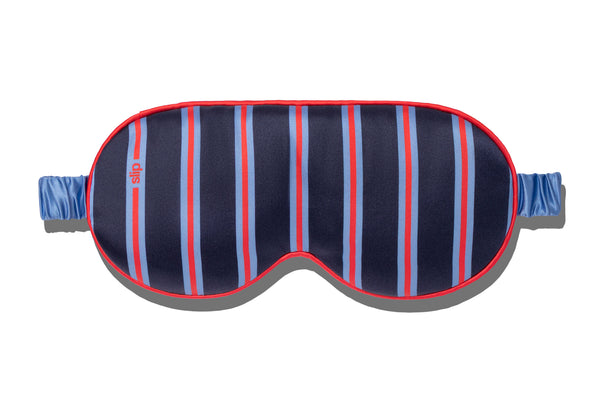 Striped sleep mask with blue and red pattern on a white background